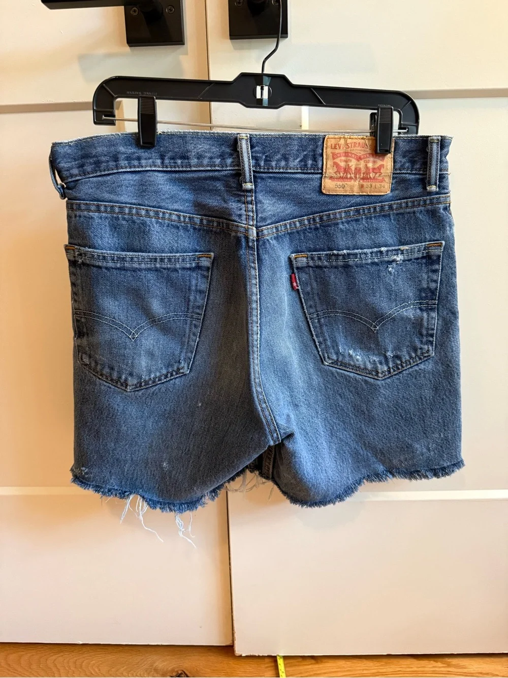 Levi’s Distressed Dark Blue Denim Cutoff Shorts